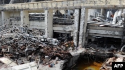 Russian emergency workers at the scene of August's accident at the Sayano-Shushenskaya hydroelectric power plant in Cheryomushky