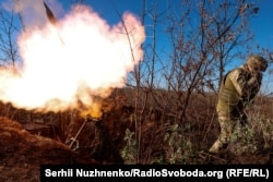 A Ukrainian mortar unit fires on Russian positions near the devastated city of Bakhmut in eastern Ukraine.