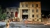 Emergency services personnel work at a local synagogue in Derbent set on fire early on June 24. 