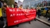 Protesters rally against allowing athletes from Russia and Belarus to participate in the 2024 Olympics in Paris in Lausanne, Switzerland, in March 2023.