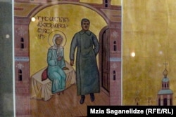 A detail of an icon inside Tbilisi's Holy Trinity Cathedral shows St. Matrona of Moscow with an image of Soviet dictator Josef Stalin.