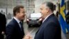 Hungarian Prime Minister Viktor Orban (right) welcomes Swedish Prime Minister Ulf Kristersson in Budapest on February 23.