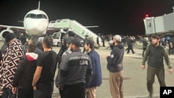 Dozens of protesters, angry over the situation surrounding the current war between Israel and Hamas militants, broke through doors and barriers at Makhachkala airport.