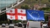 Georgians March, Wave Pairs Of Flags For Independence Day GRAB 1