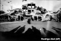 In Kandahar City, destroyed U.S. Army Humvees used in their fight against the Taliban are stacked for sale as scrap metal.