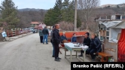 Residents of Krivelj take turns blocking the road to the mine operated by the Zijin Mining Group.