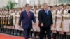 Hungarian Prime Minister Viktor Orban (right) and his Chinese counterpart, Li Qiang, review an honor guard during a welcome ceremony in Beijing on October 16, 2023.