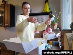 Katsyaryna Yeudakimava-Yendzheyeuskaya with handcrafted decorations in her Bialystok apartment.