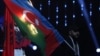 A protester burns the Azerbaijani flag during the opening ceremony of the European Weightlifting Championship in Yerevan on April 14.