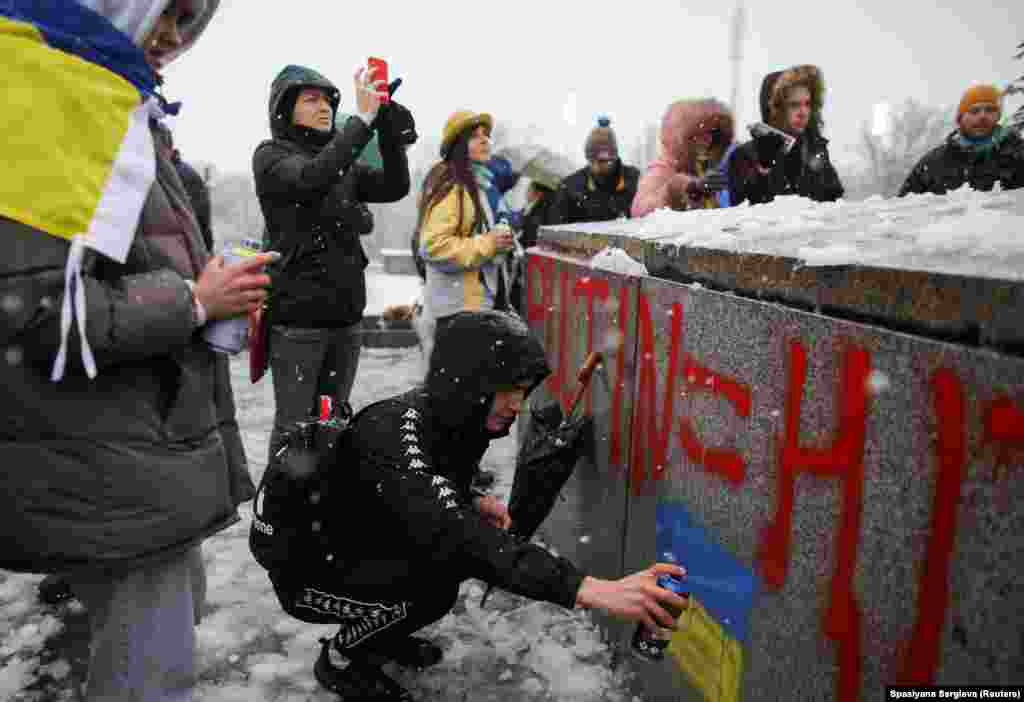 Anti-war activists deface the Soviet monument on February 27, 2022.&nbsp; Inside Bulgaria, opinions of Russian President Vladimir Putin were mostly positive, at up to 58 percent, between 2020 and 2022, but plummeted to just 32 percent in the days after the Ukraine invasion was launched.&nbsp;