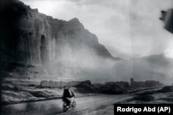 Villagers ride a motorcycle near the remnants of the giant Buddha statue destroyed by the Taliban in 2001, in Bamiyan on June 18.