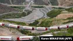 Armenian trucks carrying humanitarian aid for Nagorno-Karabakh are seen stranded not far away from an Azerbaijani checkpoint set up at the entry of the Lachin Corridor on July 30.