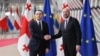 Georgian Prime Minister Irakli Gharibashvili (left) meets with European Council President Charles Michel in Brussels on April 25.