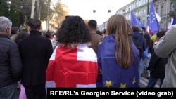 People march through the capital, Tbilisi, against the reintroduction of the "foreign agents" bill on April 9.