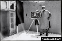 Street photographer Lutfullah Habibzadeh, 72, poses for a portrait at his house on the outskirts of Kabul on May 29.