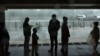 People take shelter from hurricane-force winds and pounding rain that swept Moscow on June 20.