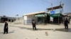 Pakistani security officials stand guard at the border on September 7 following clashes between security forces of Pakistan and Afghanistan near the Torkham crossing.