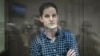 Evan Gershkovich stands inside a defendants' cage before a hearing to consider an appeal on his arrest at the Moscow City Court in Moscow on April 18.