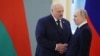 Russian President Vladimir Putin (right) and Alyaksandr Lukashenka shake hands during a meeting at the Kremlin in Moscow in April.