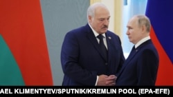 Russian President Vladimir Putin (right) and Alyaksandr Lukashenka shake hands during a meeting at the Kremlin in Moscow in April.