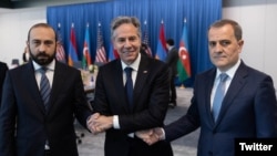 U.S. Secretary of State Secretary Antony Blinken (center) shakes hands with Armenian Foreign Affairs Minister Ararat Mirzoyan (left) and Azerbaijani Foreign Affairs Minister Jeyhun Bayramov on May 1.