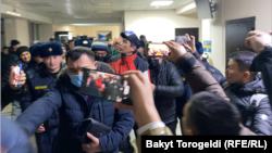 Detained journalists appear at the Birinchi Mai district court in Bishkek on January 17.