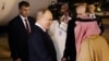 Russian President Vladimir Putin is greeted upon arrival at the airport in Riyadh on December 6.