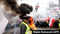 Farmers in Warsaw protest on March 6 against EU &quot;Green Deal&quot; measures, and duty-free imports of Ukrainian food to Poland.&nbsp;