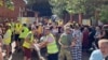 At a distribution center for humanitarian aid in the southern Russian city of Kursk, workers load and unload supplies for people who have fled ahead of Ukraine's incursion into the region. 