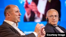 Mikhail Khodorkovsky (right) listens to a speaker at the 2024 Globsec international security forum in Prague on August 31.