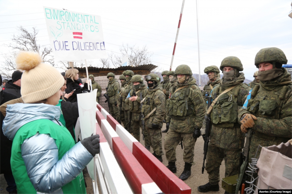 Russian peacekeepers face Azerbaijanis blocking the highway connecting Nagorno-Karabakh to Armenia on December 13. (Photo by Azertac) Dozens of Azerbaijanis first blocked the road, known as the Lachin Corridor, on December 12. The group declared themselves &ldquo;eco-activists&rdquo; who were protesting the extraction of gold by ethnic Armenians from mines in surrounding areas of Azerbaijan. Spontaneous protests are routinely broken up within minutes by police in Azerbaijan, and many have accused Baku of staging the Lachin protest to put pressure on Yerevan and Karabakh Armenians.&nbsp;