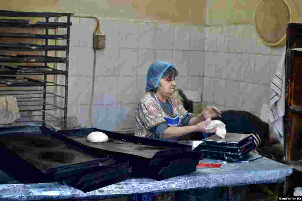 Lida Mikayelian portions dough in a bakery in Stepanakert. The baker told photographer Vanian: &ldquo;There is still bread, thank God, but there are no vegetables at all.&rdquo; The 87-year-old said the Russian peacekeepers tasked with protecting the Lachin Corridor have become increasingly toothless as Russia&rsquo;s disastrous invasion of Ukraine grinds on. &ldquo;Azerbaijan is using this moment to advance its plans,&rdquo; Mikayelian said, adding, &ldquo;Russia is not able to maintain our security, but at the same time, it doesn&rsquo;t want to &lsquo;lose&rsquo; us. This is the situation.&rdquo;