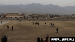 Taliban officials and other spectators gather in Parwan Stadium in Charakar to witness the lashings on October 8. 