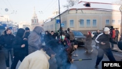 Youths attack participants in an opposition-sponsored march in Moscow.