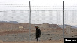 An Iranian soldier stands guard inside the uranium-enrichment facility in Natanz. (file photo)