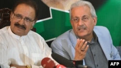 Senator Raza Rabbani (right) and Pakistan Peoples Party leader Ameen Fahim