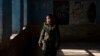 An Afghan schoolgirl stands in an empty classroom in Kabul after the Taliban barred teenage girls from attending secondary school.