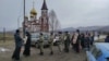 Residents take part in a procession for peace in the Siberian city of Krasnoyarsk on November 25.