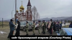 Residents take part in a procession for peace in the Siberian city of Krasnoyarsk on November 25.