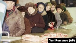 Muscovites wait to buy meat in Moscow in 1991. Will such communist-era lines become commonplace in Russia once more? 