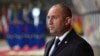 Bulgarian President Rumen Radev addresses the media as he arrives for an EU summit in Brussels on June 24.