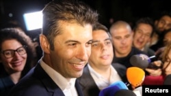 The party of former Prime Minister Kiril Petkov, shown talking to journalists after polling on October 2, came in second in the vote with 20.2 percent.