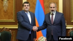 Armenian Prime Minister Nikol Pashinian (right) meets with Arayik Harutiunian in Yerevan in October 2022.