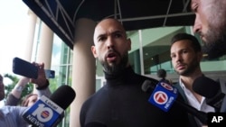 Andrew Tate speaks to journalists at the Fort Lauderdale airport on February 27, 2025.