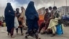 Afghan women walk on a street in the capital, Kabul, on May 10.
