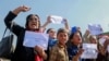 Afghan women shout slogans during a protest to demand the Taliban-led government allow the reopening of girls' schools and to provide ample employment opportunities, in Kabul on October 21.