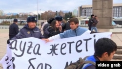 Police detain opposition activists in Almaty on November 20.