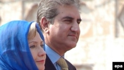 Pakistani Foreign Minister Shah Mehmood Qureshi with his U.S. counterpart, Hillary Clinton, during Clinton's visit to Lahore on October 29.