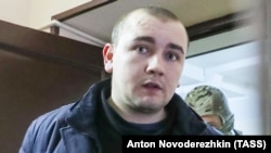 SBU officer Andriy Drach is escorted inside a court building in Moscow on January 15.