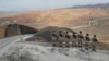 Turkish forces man the new border wall along the Turkish-Iranian border in Turkey's Van Province. 